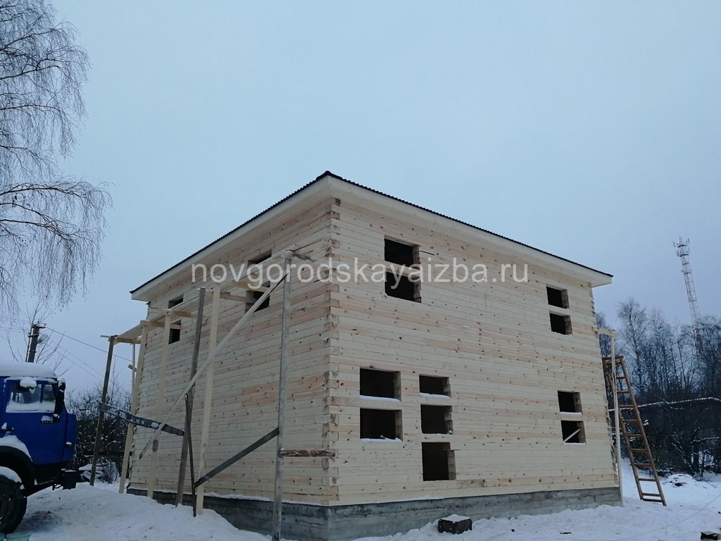 Двухэтажный дом из бруса под усадку